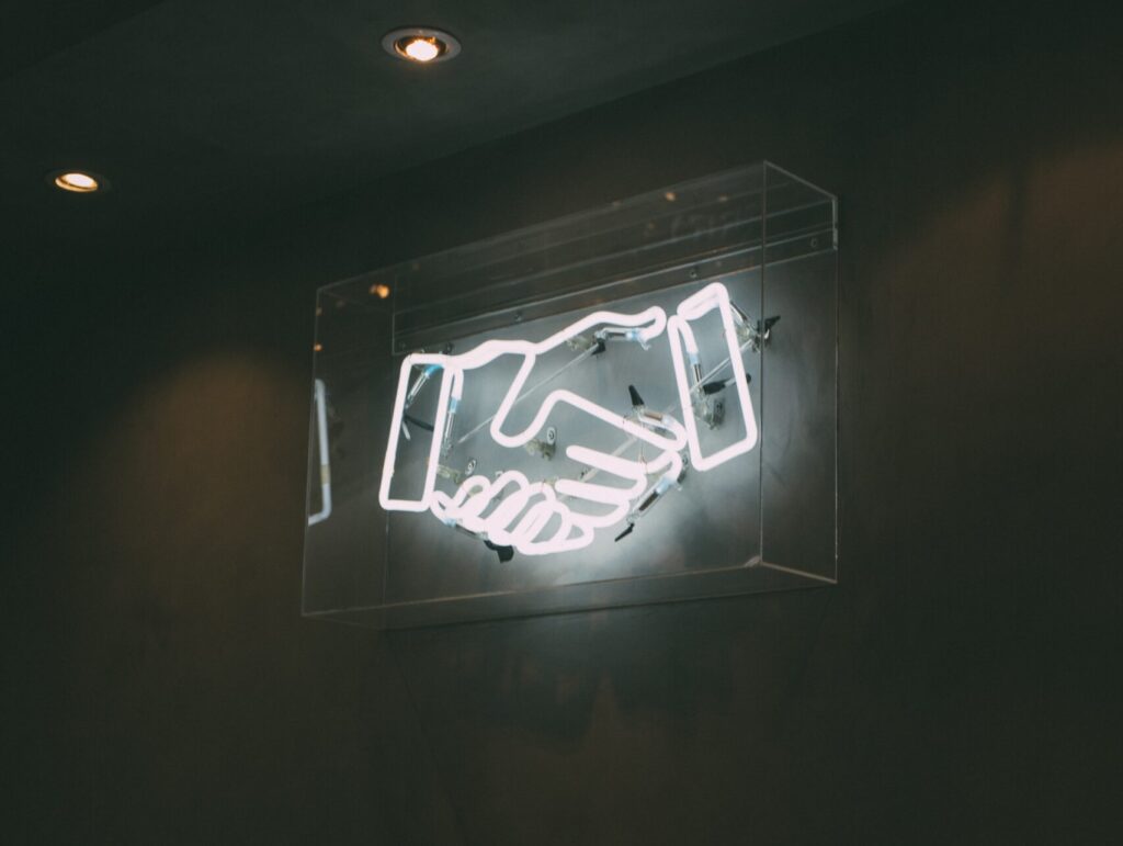 Handshake neon sign